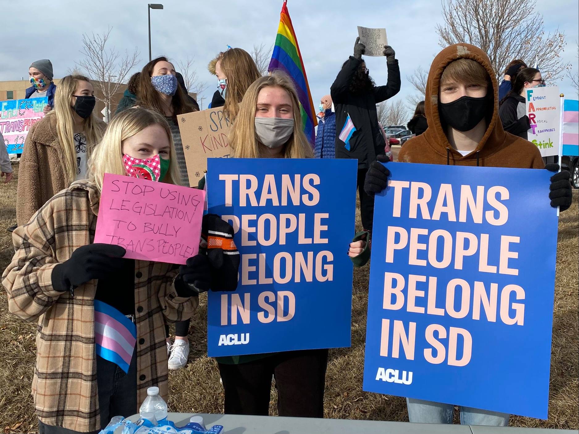 South Dakota Protest Image with people holding "trans people belong in SD" signs