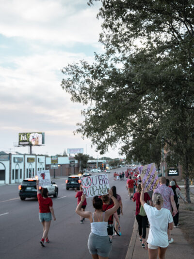 image of people protesting down a street