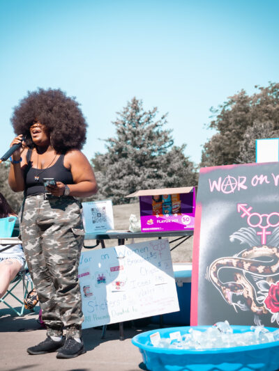 Image of a person speaking at a protest