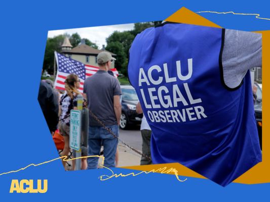 An ACLU of South Dakota legal observer, wearing a blue vest, is working at a protest.