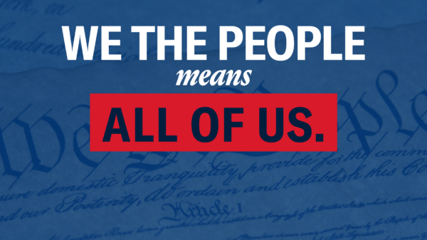 Photo of the U.S. Constitution with a blue hue. Text that reads "We the people means all of us."
