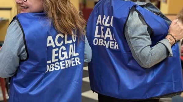 An image of two women in Aberdeen wearing election observer vests