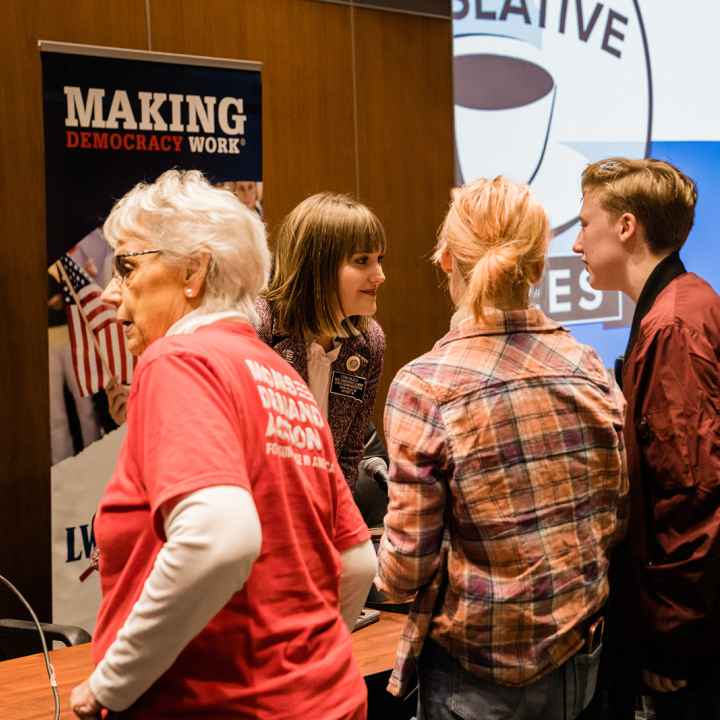 People discussing at a Legislative Coffee