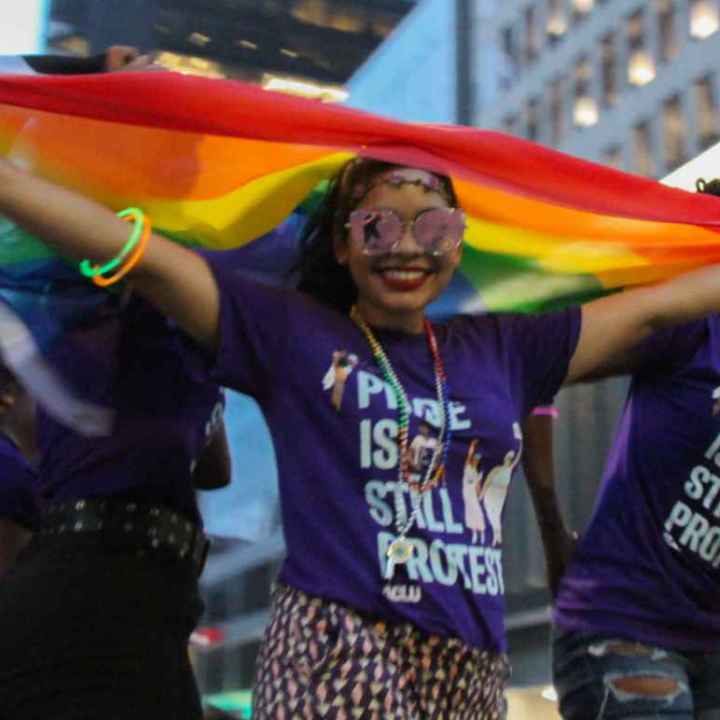 Person wearing a "Pride is still protest" t-shirt Person wearing a "Pride is still protest" t-shirt